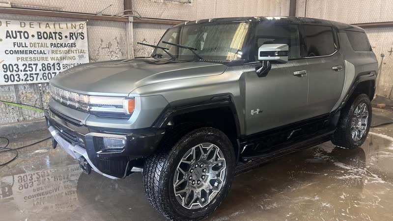 Gray GMC Hummer EV after a wash inside the shop