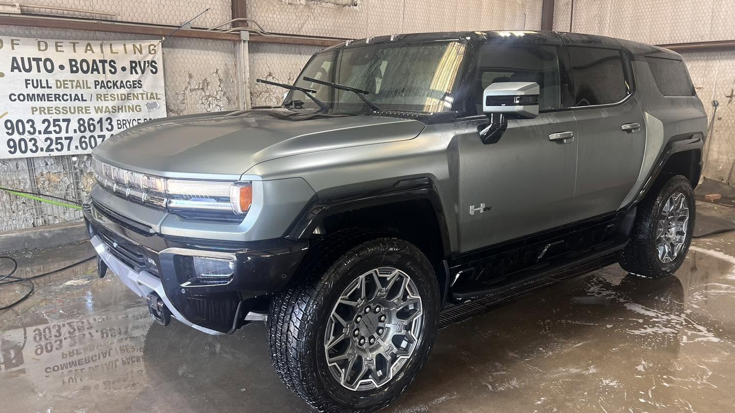Gray GMC Hummer EV after a wash inside the shop